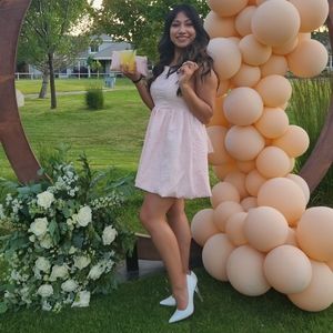 Blush short , back tied dress